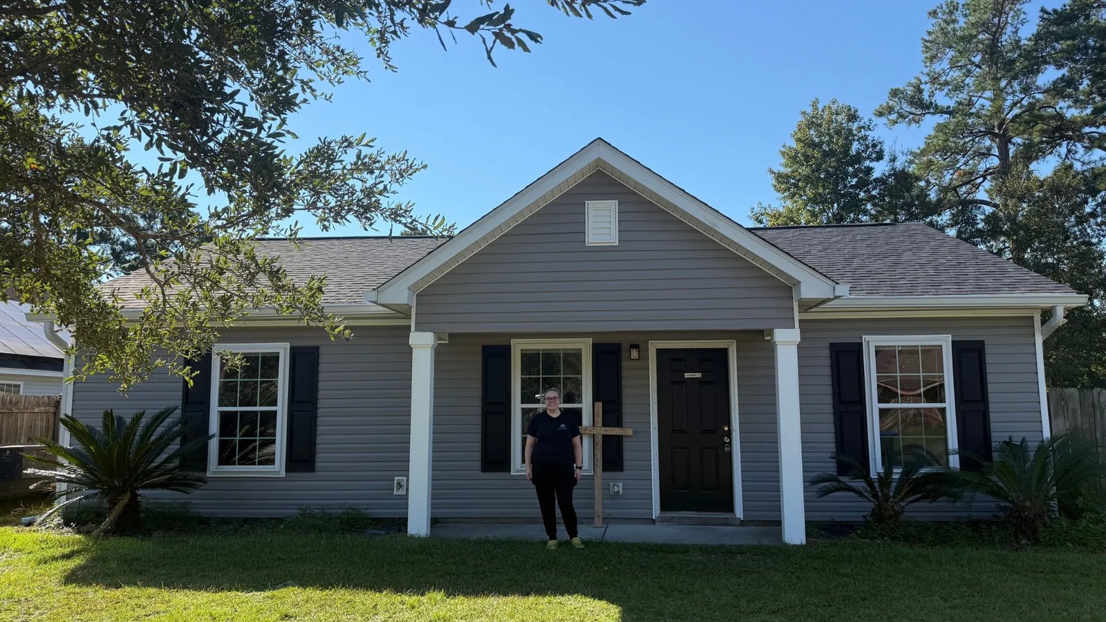alexis-wilson-drive-home Alexis standing in front of her future Habitat home on Wilson Drive in Summerville